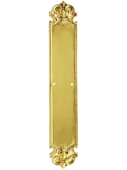 French Baroque Push Plate In Unlacquered Brass.